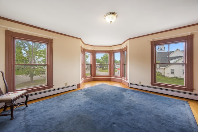 123 Main St, Newport, ME 04953 - unfurnished room with wood finished floors, plenty of natural light, ornamental molding, and baseboard heating