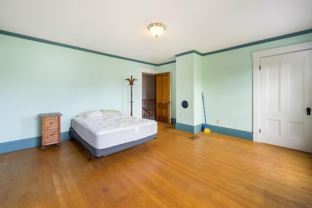 123 Main St, Newport, ME 04953 - bedroom featuring hardwood / wood-style flooring, baseboards, and crown molding