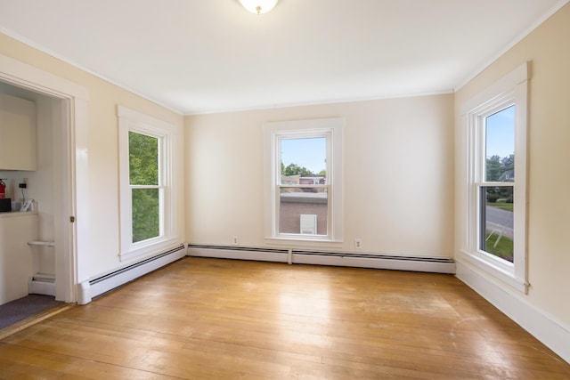 123 Main St, Newport, ME 04953 - empty room with crown molding, light wood-style floors, and a baseboard heating unit