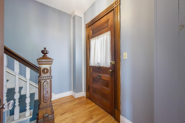 123 Main St, Newport, ME 04953 - foyer entrance with light wood-style floors, baseboards, and stairway