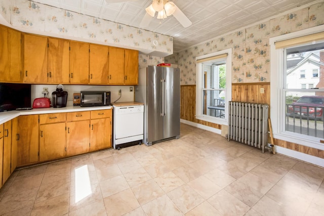123 Main St, Newport, ME 04953 - kitchen featuring high end fridge, radiator heating unit, black microwave, white dishwasher, and an ornate ceiling