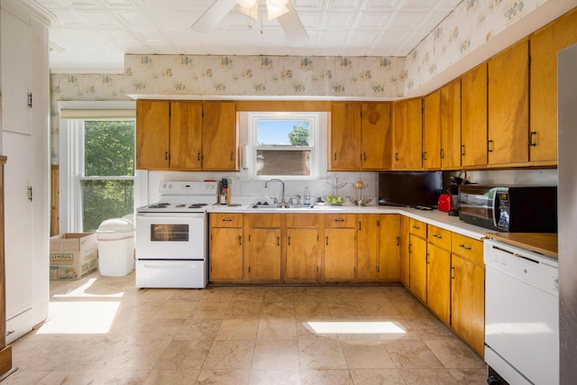 123 Main St, Newport, ME 04953 - kitchen with white appliances, an ornate ceiling, a sink, wallpapered walls, and light countertops
