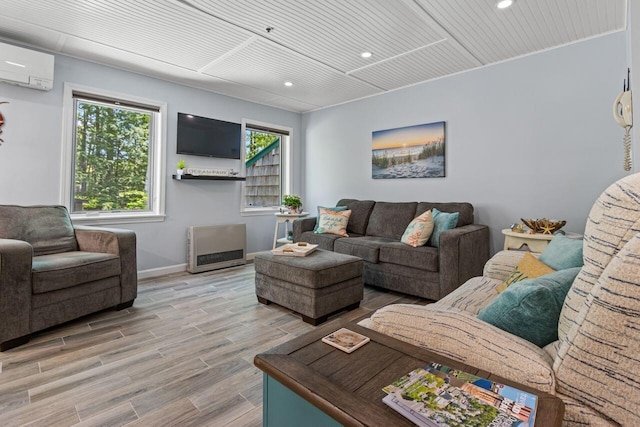 131 Temple Ave Unit 26, Old Orchard Beach, ME 04064 - living room featuring a wall mounted AC, recessed lighting, light wood-style floors, and baseboards