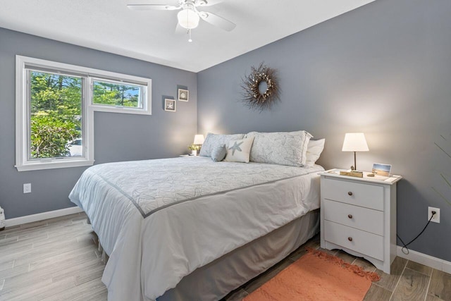 131 Temple Ave Unit 26, Old Orchard Beach, ME 04064 - bedroom with baseboards, light wood-style floors, and a ceiling fan