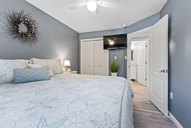 131 Temple Ave Unit 26, Old Orchard Beach, ME 04064 - bedroom with wood finished floors, a closet, baseboards, a ceiling fan, and lofted ceiling