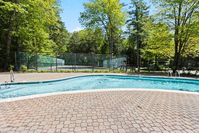 131 Temple Ave Unit 26, Old Orchard Beach, ME 04064 - community pool featuring view of wooded area and a patio