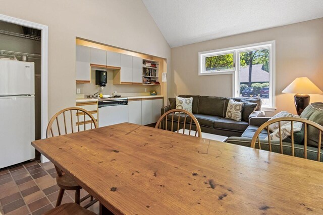 131 Temple Ave Unit 26, Old Orchard Beach, ME 04064 - dining area with lofted ceiling