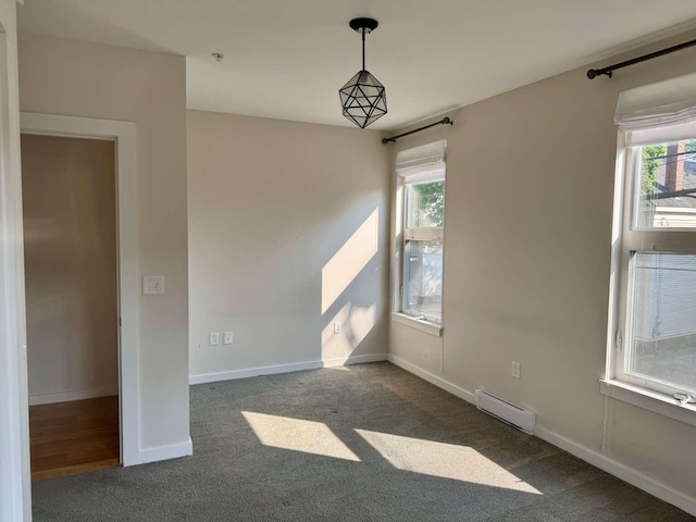 65 Munjoy St Unit 4, Portland, ME 04101 - carpeted empty room featuring a baseboard heating unit, healthy amount of natural light, and baseboards
