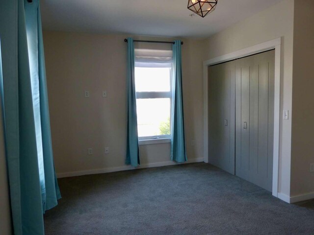 65 Munjoy St Unit 4, Portland, ME 04101 - unfurnished bedroom with carpet flooring and a closet