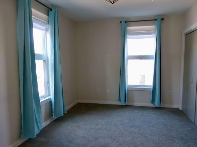 65 Munjoy St Unit 4, Portland, ME 04101 - empty room with healthy amount of natural light and carpet