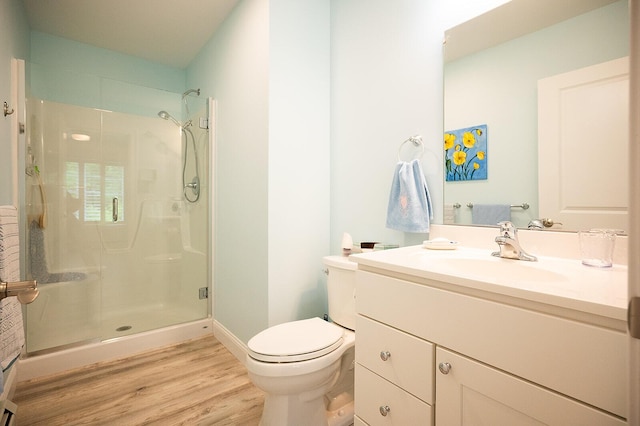 11 Unity Ln Unit 11, Windham, ME 04062 - bathroom featuring a shower stall, vanity, toilet, wood finished floors, and baseboards