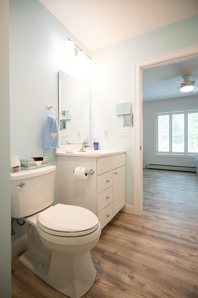 11 Unity Ln Unit 11, Windham, ME 04062 - half bath featuring toilet, wood finished floors, baseboard heating, vanity, and baseboards