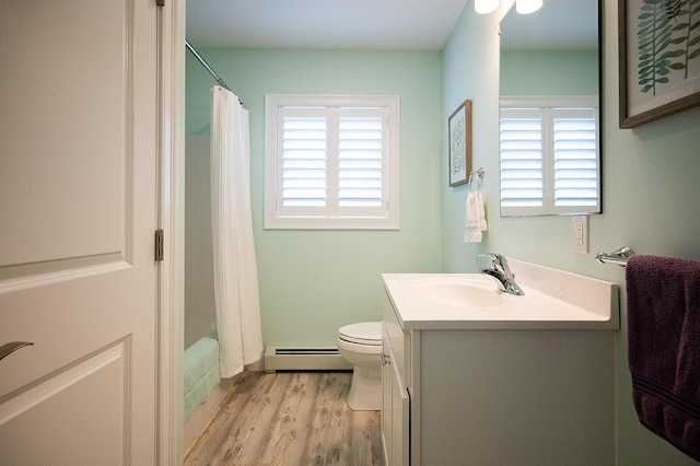 11 Unity Ln Unit 11, Windham, ME 04062 - full bathroom featuring a baseboard radiator, vanity, wood finished floors, toilet, and shower / tub combo