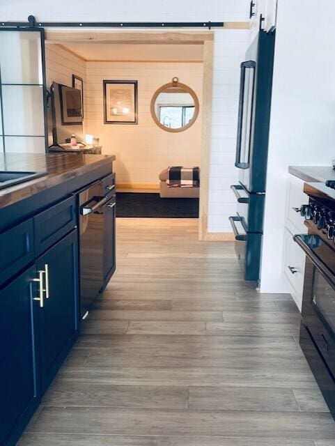 32 Water St, Lubec, ME 04652 - hall featuring wood finished floors and a barn door