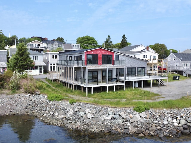 32 Water St, Lubec, ME 04652 - back of house with a deck with water view and a residential view