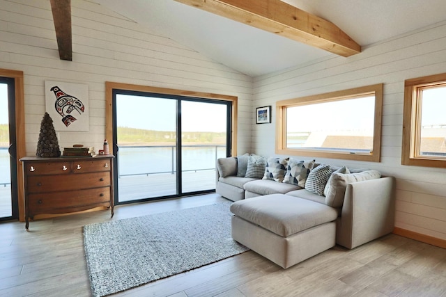 32 Water St, Lubec, ME 04652 - living area with healthy amount of natural light, wooden walls, and light wood-type flooring