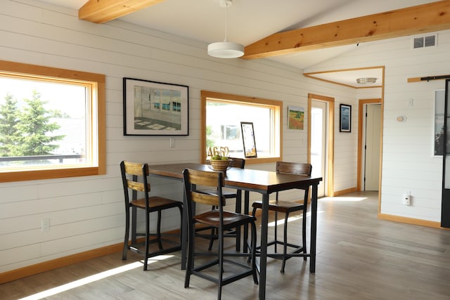 32 Water St, Lubec, ME 04652 - dining area with wooden walls and light wood-style flooring