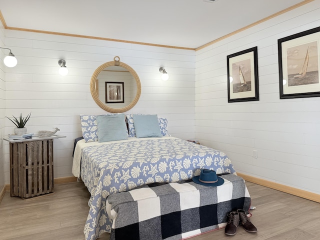 32 Water St, Lubec, ME 04652 - bedroom featuring wood finished floors, crown molding, and wood walls