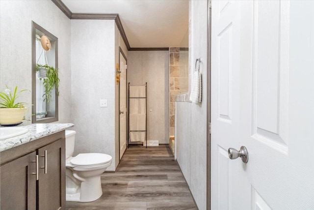 833 Sedgwick Ridge Rd, Sedgwick, ME 04676 - full bathroom with vanity, wood finished floors, and ornamental molding