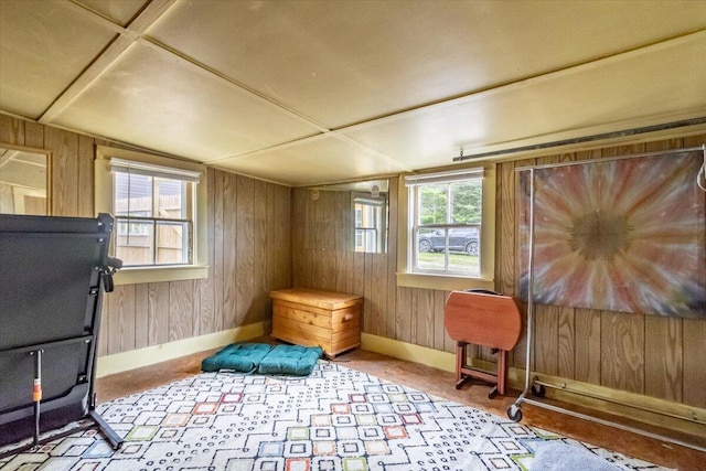 833 Sedgwick Ridge Rd, Sedgwick, ME 04676 - sitting room with wood walls, plenty of natural light, and carpet floors
