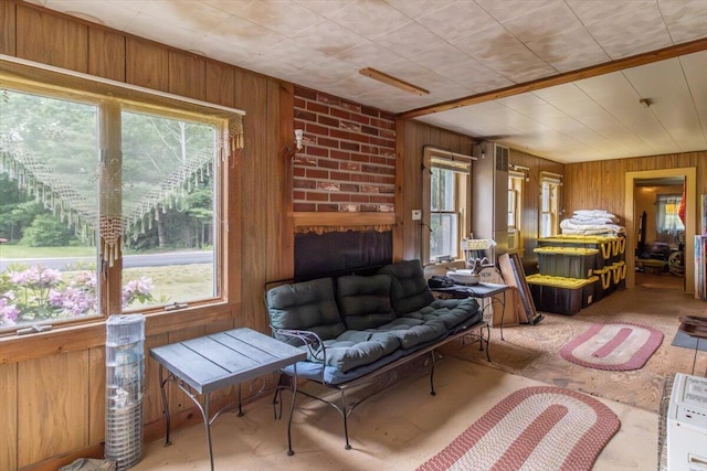 833 Sedgwick Ridge Rd, Sedgwick, ME 04676 - sitting room featuring wood walls and healthy amount of natural light