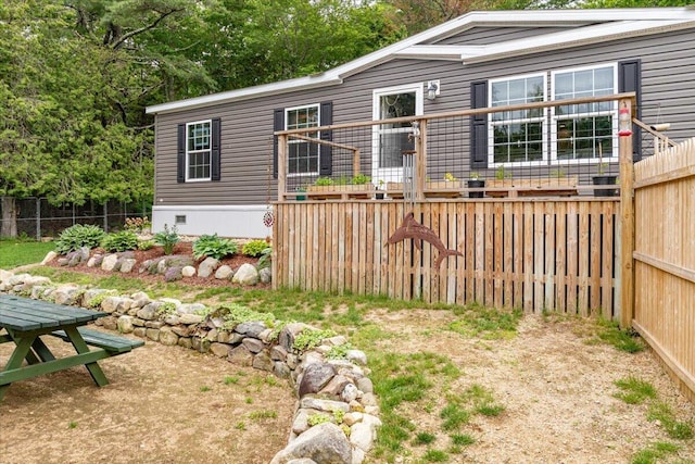 833 Sedgwick Ridge Rd, Sedgwick, ME 04676 - rear view of house featuring crawl space