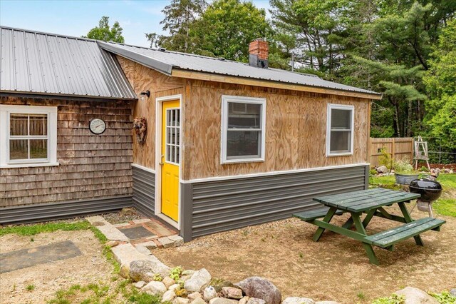 833 Sedgwick Ridge Rd, Sedgwick, ME 04676 - view of side of property with a metal roof