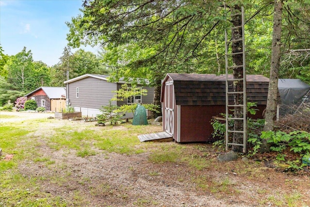 833 Sedgwick Ridge Rd, Sedgwick, ME 04676 - view of yard featuring a shed