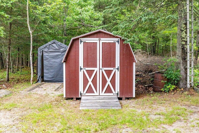 833 Sedgwick Ridge Rd, Sedgwick, ME 04676 - view of shed with a view of trees
