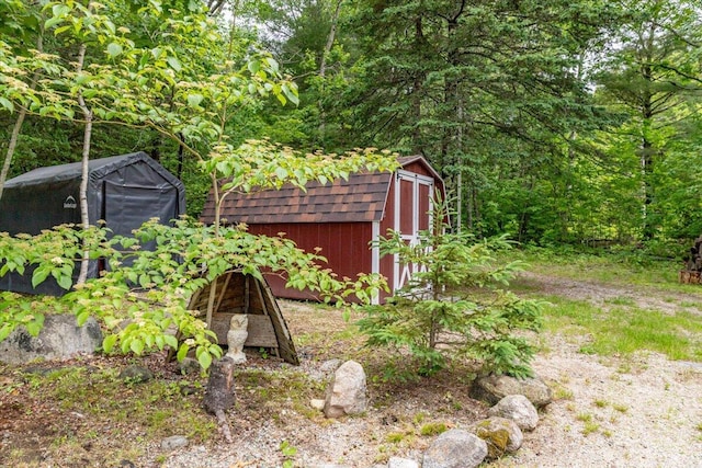 833 Sedgwick Ridge Rd, Sedgwick, ME 04676 - view of yard featuring a storage unit