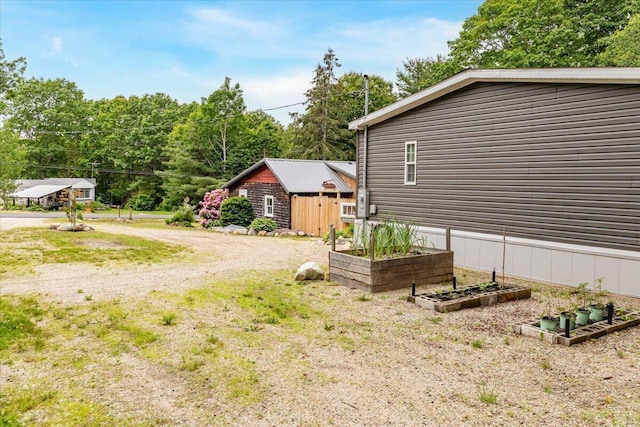 833 Sedgwick Ridge Rd, Sedgwick, ME 04676 - view of yard featuring a vegetable garden