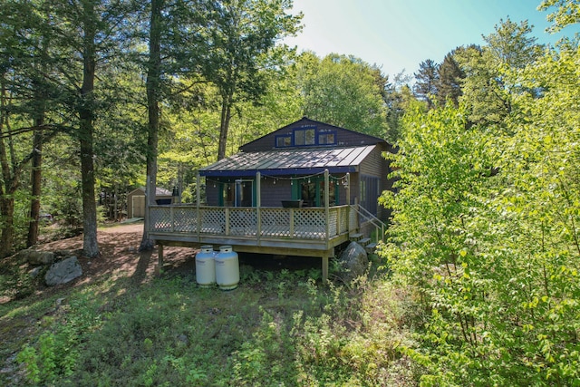 200 Flanders Pond Rd, Sullivan, ME 04664 - back of property featuring a standing seam roof, metal roof, and a deck