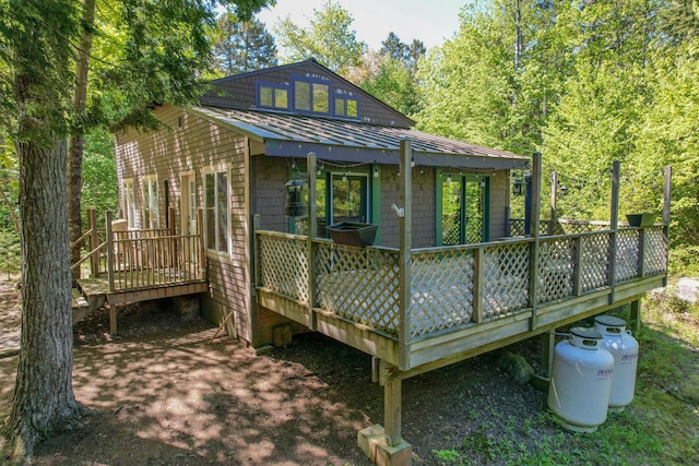 200 Flanders Pond Rd, Sullivan, ME 04664 - back of property featuring a wooden deck, metal roof, and a standing seam roof