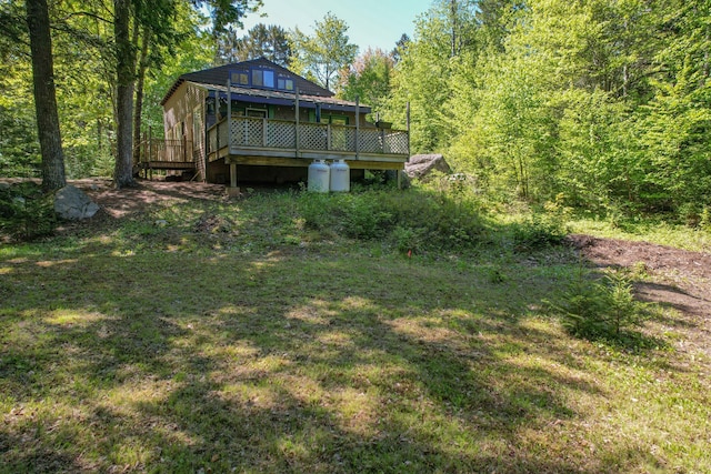 200 Flanders Pond Rd, Sullivan, ME 04664 - rear view of house featuring a wooden deck and a yard