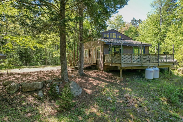 200 Flanders Pond Rd, Sullivan, ME 04664 - view of yard with a wooden deck and a wooded view