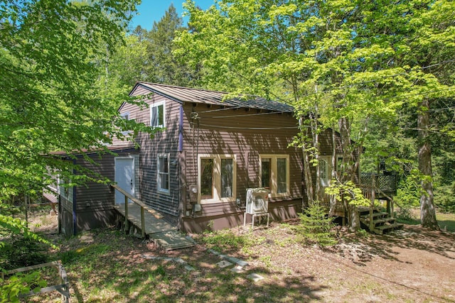 200 Flanders Pond Rd, Sullivan, ME 04664 - view of home's exterior featuring a deck and metal roof