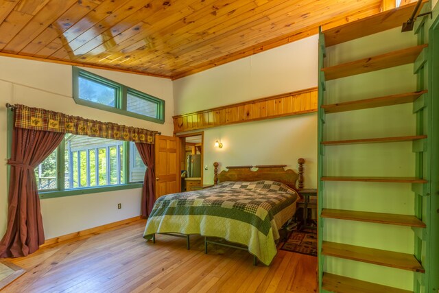 200 Flanders Pond Rd, Sullivan, ME 04664 - bedroom featuring wood ceiling, light wood finished floors, and a towering ceiling