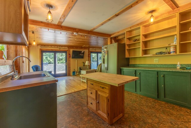 200 Flanders Pond Rd, Sullivan, ME 04664 - kitchen featuring green cabinetry, a sink, stainless steel fridge with ice dispenser, wood counters, and open shelves