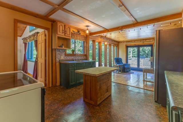 200 Flanders Pond Rd, Sullivan, ME 04664 - kitchen with stove, freestanding refrigerator, butcher block counters, plenty of natural light, and beam ceiling