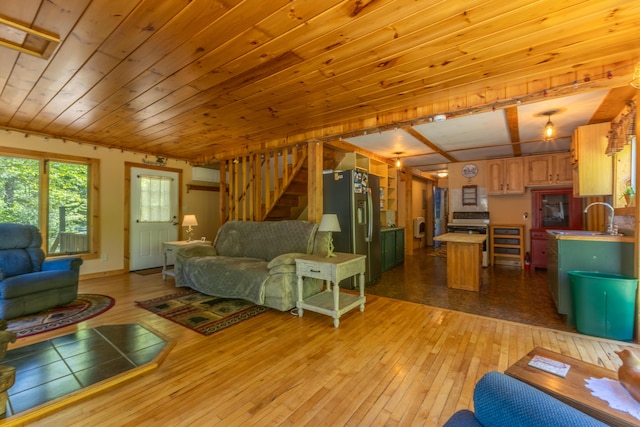 200 Flanders Pond Rd, Sullivan, ME 04664 - living area featuring light wood-style floors, stairway, and wood ceiling