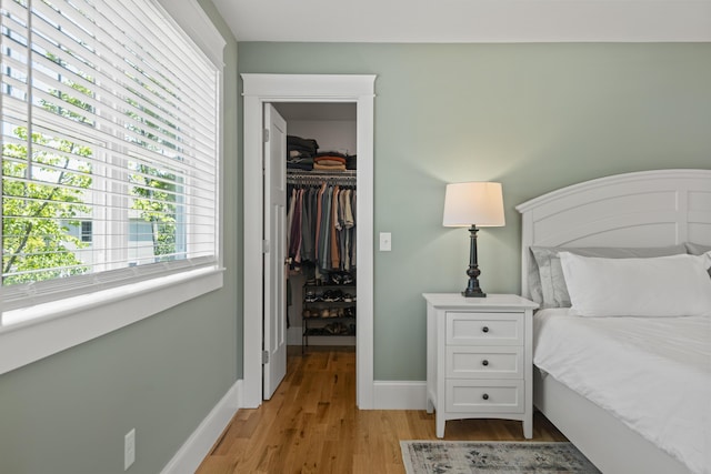 15 Adena Way, Kennebunk, ME 04043 - bedroom with a spacious closet, a closet, light wood-style floors, and baseboards