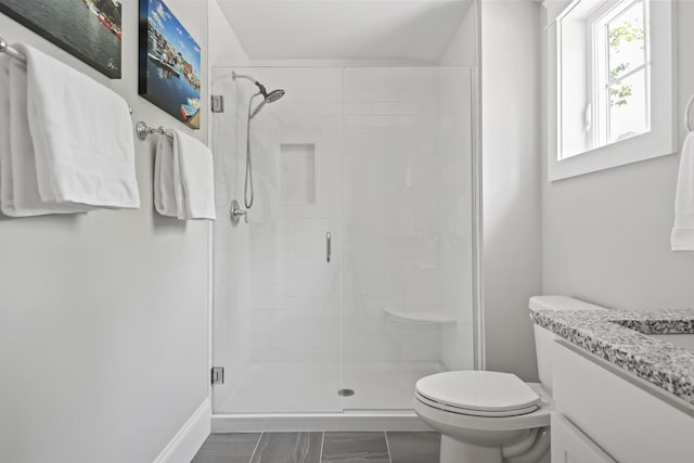 15 Adena Way, Kennebunk, ME 04043 - full bathroom featuring vanity, a stall shower, toilet, and marble look tiles