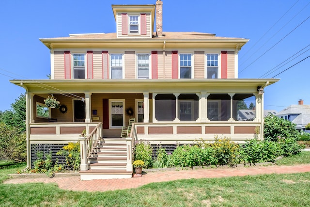 view of front of house featuring covered porch and a chimney