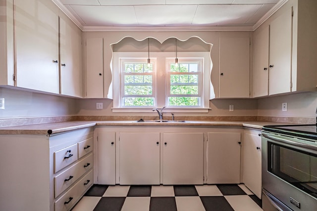 kitchen with stainless steel electric range oven, a sink, crown molding, white cabinetry, and light countertops