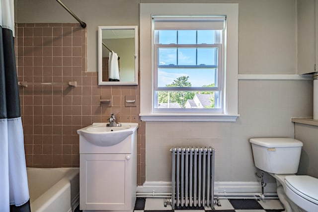 full bathroom featuring radiator heating unit, tile walls, toilet, vanity, and shower / bath combination with curtain