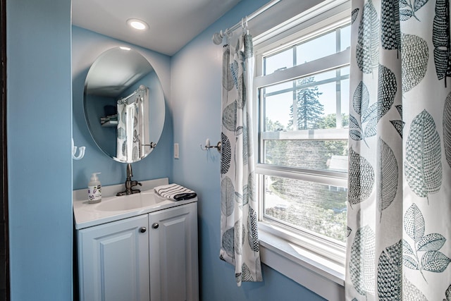 bathroom featuring vanity and recessed lighting