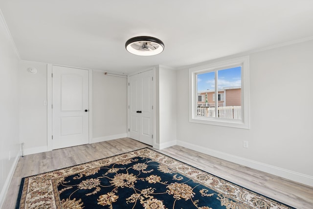 5 Kinney Ave Unit 303, Old Orchard Beach, ME 04064 - entryway with wood finished floors, baseboards, and ornamental molding