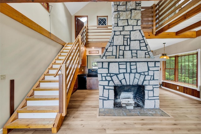 30 Otter Cove Ln, North Berwick, ME 03906 - stairs with a towering ceiling, wood finished floors, baseboards, and a fireplace