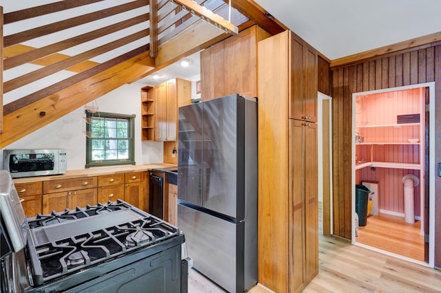 30 Otter Cove Ln, North Berwick, ME 03906 - kitchen with freestanding refrigerator, range with gas stovetop, light wood finished floors, open shelves, and brown cabinetry