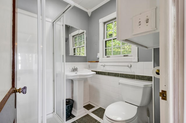 30 Otter Cove Ln, North Berwick, ME 03906 - bathroom with tile walls, toilet, tile patterned floors, a sink, and a stall shower